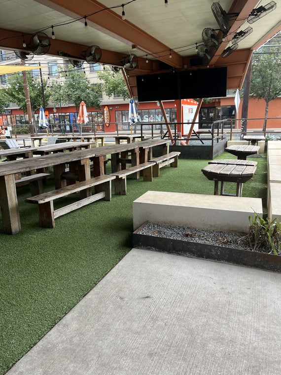 The covered patio bar, fans and TVs waiting for game day